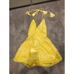 Yellow, open back romper